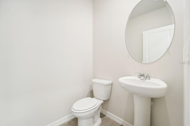 bathroom with sink and toilet