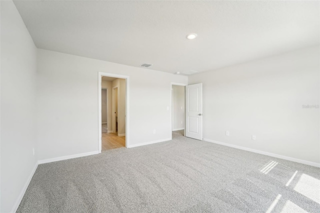 unfurnished bedroom with light colored carpet