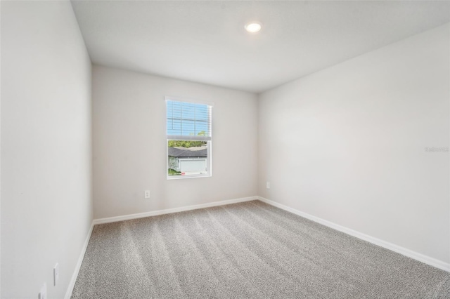 spare room featuring carpet flooring