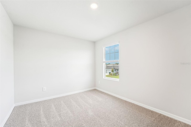 empty room with carpet flooring