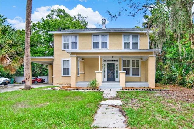 view of front of property with covered porch and a front yard