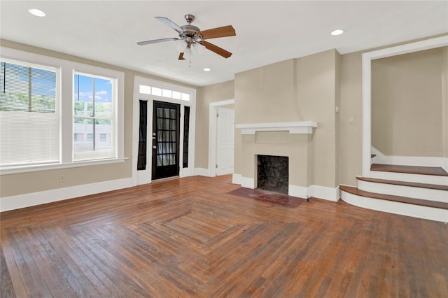 unfurnished living room featuring parquet flooring and ceiling fan