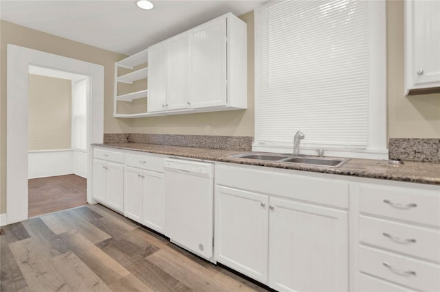 kitchen with dishwasher, light hardwood / wood-style flooring, white cabinetry, and sink