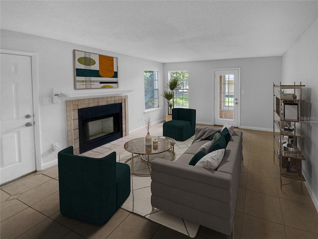 living room featuring tile patterned flooring, a textured ceiling, and a tiled fireplace