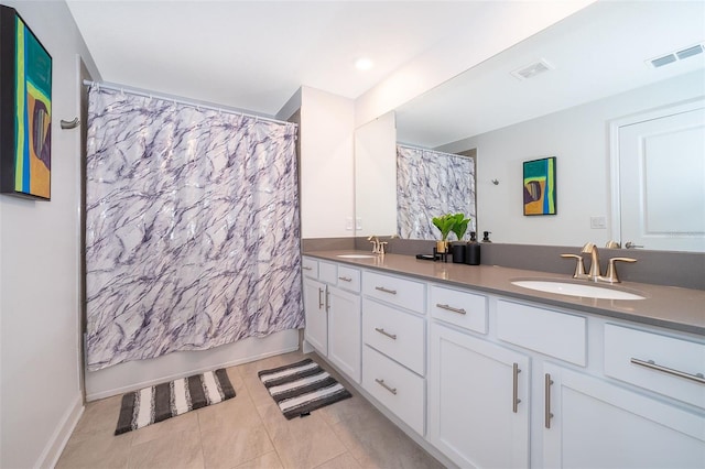 bathroom featuring tile patterned floors, vanity, and shower / bath combination with curtain