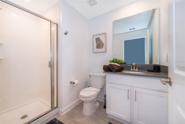 bathroom featuring toilet, vanity, tile patterned floors, and an enclosed shower