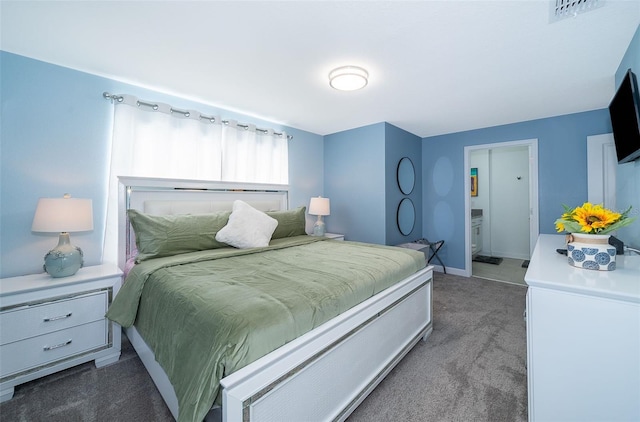 bedroom with dark colored carpet