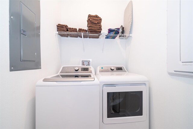 laundry area featuring separate washer and dryer and electric panel