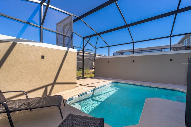 view of pool featuring a patio and a lanai