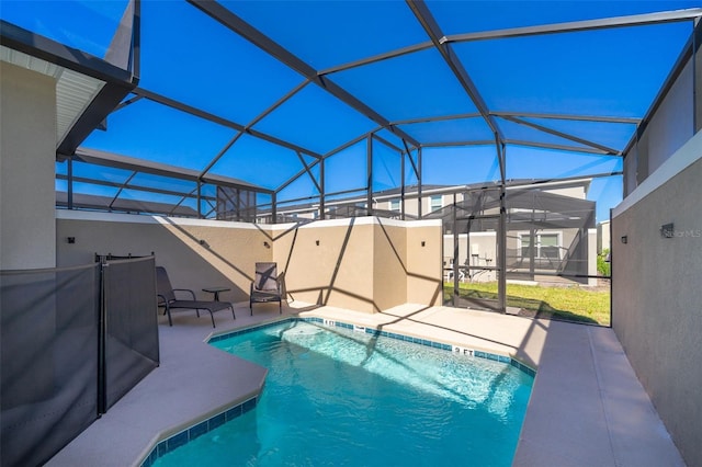 view of pool featuring a patio area and a lanai