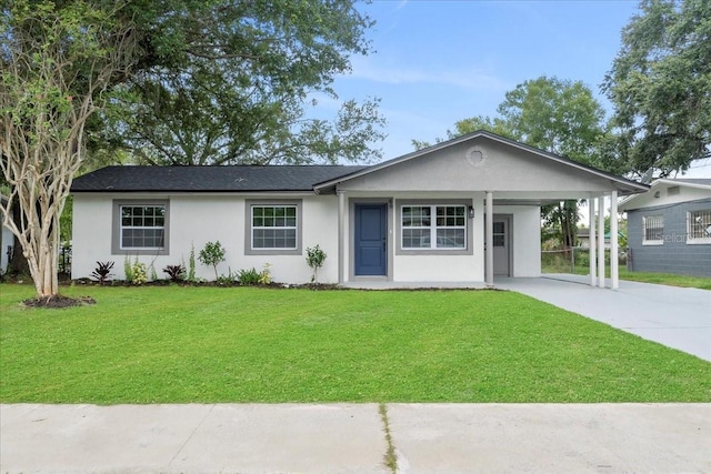 single story home featuring a carport and a front yard