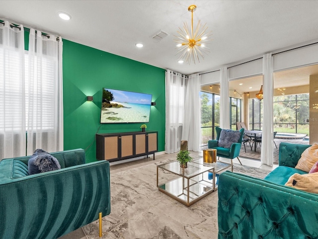 living room featuring a notable chandelier