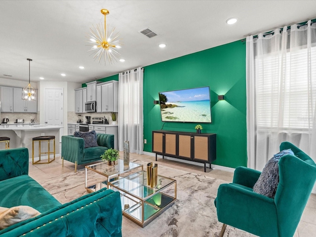 living room featuring an inviting chandelier