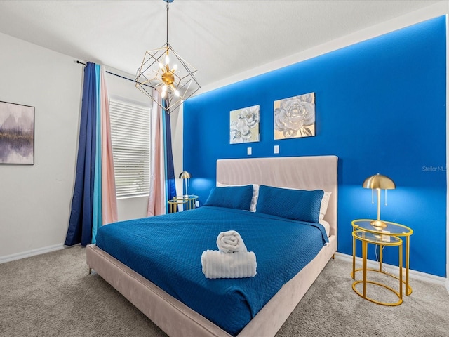 carpeted bedroom with a chandelier