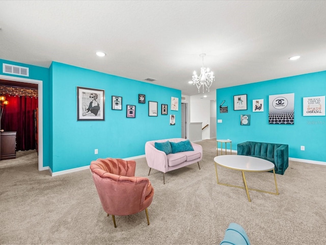 carpeted living room featuring a notable chandelier