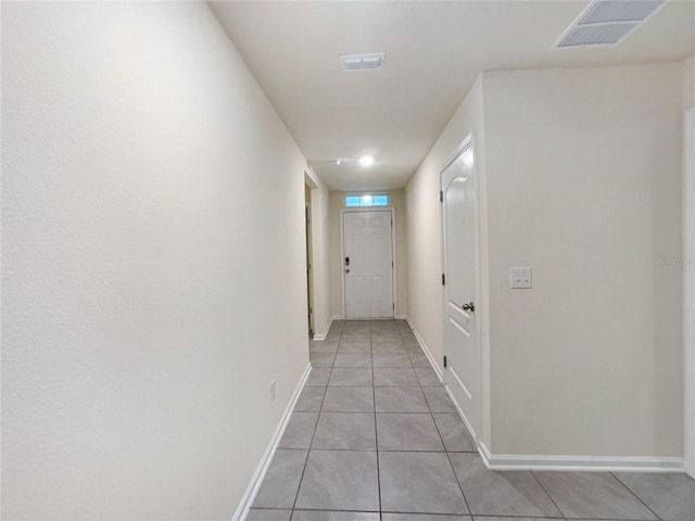 hall with light tile patterned flooring