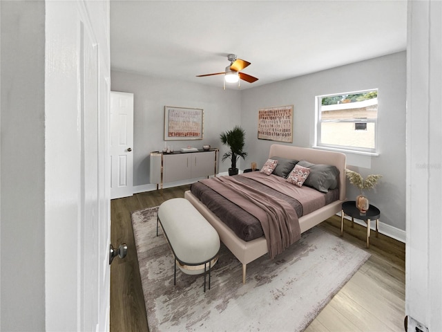 bedroom featuring light hardwood / wood-style flooring and ceiling fan