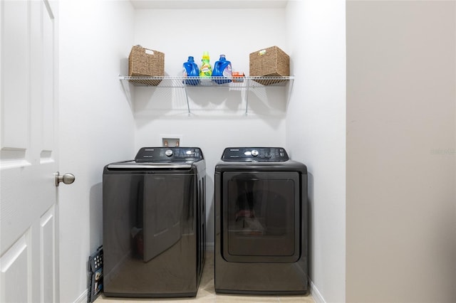 washroom with washing machine and dryer