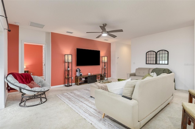 living room featuring ceiling fan and light colored carpet