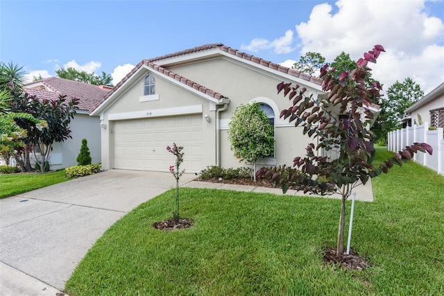 view of front facade featuring a front yard and a garage