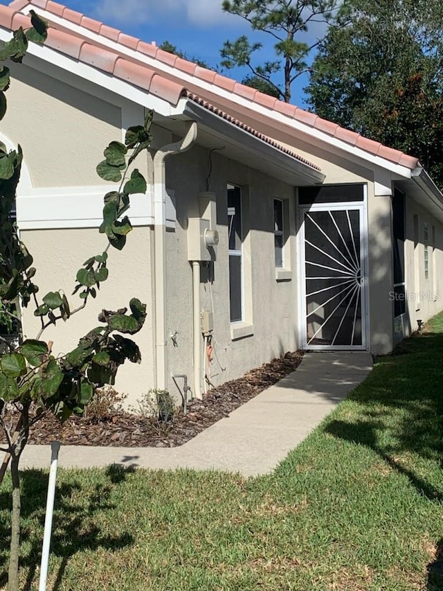 view of home's exterior with a yard