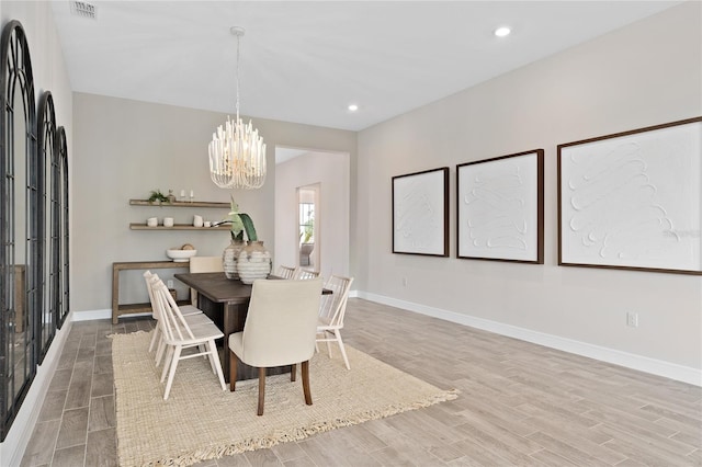 dining space with a chandelier