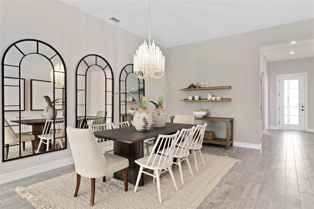 dining space featuring an inviting chandelier