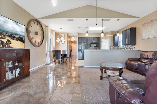 living room with vaulted ceiling and sink