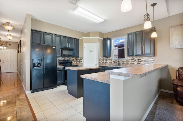 kitchen with sink, tasteful backsplash, decorative light fixtures, kitchen peninsula, and black appliances