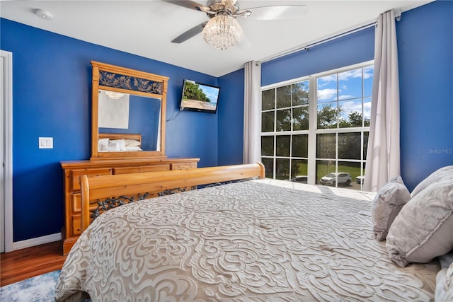 bedroom featuring hardwood / wood-style flooring and ceiling fan