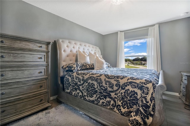 bedroom with wood-type flooring