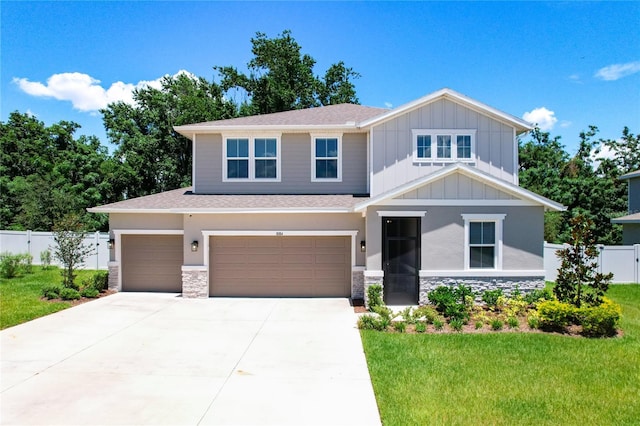 view of front of home featuring a garage and a front lawn