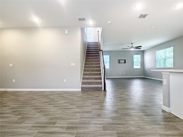 interior space with ceiling fan