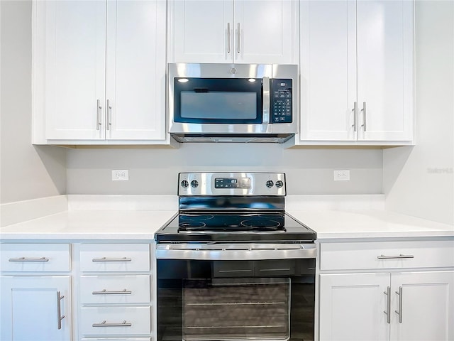 kitchen with white cabinetry and stainless steel appliances