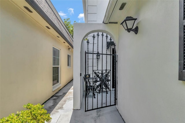 entrance to property featuring stucco siding