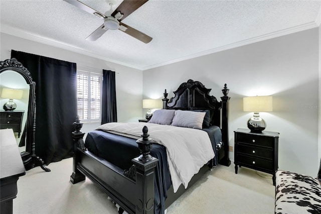 bedroom with a textured ceiling, ornamental molding, a ceiling fan, and light colored carpet