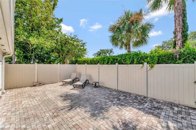 view of patio / terrace featuring fence