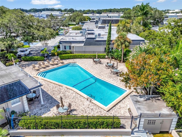 pool featuring a patio and fence