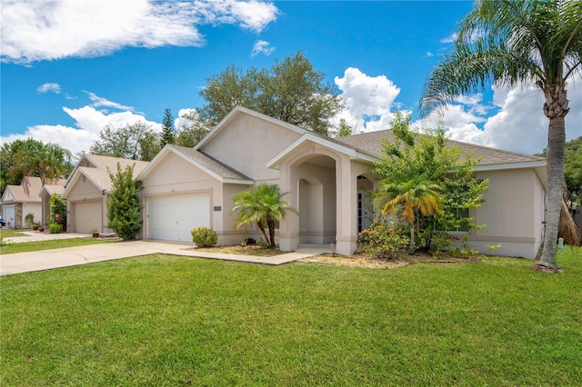 view of front of house with a garage and a front lawn