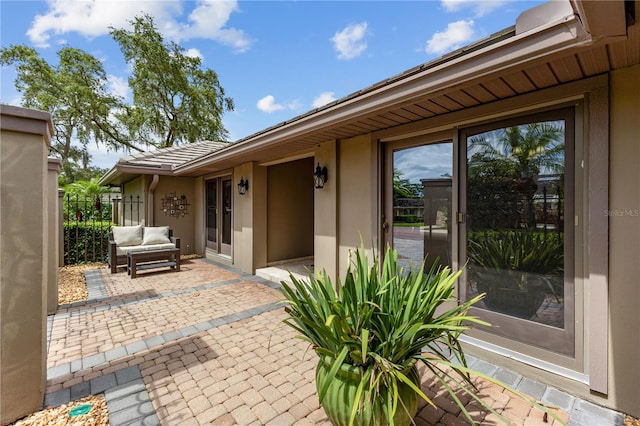 property entrance with a patio