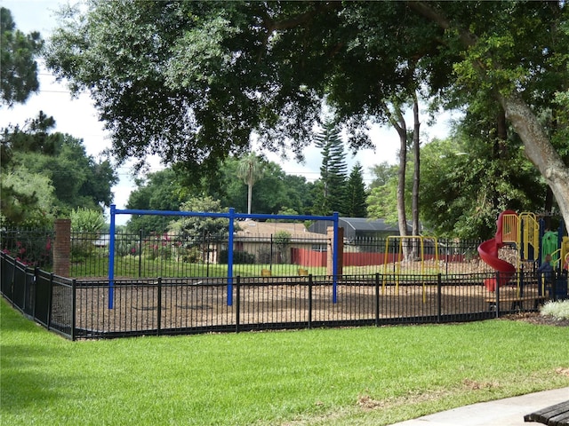 view of playground with a lawn