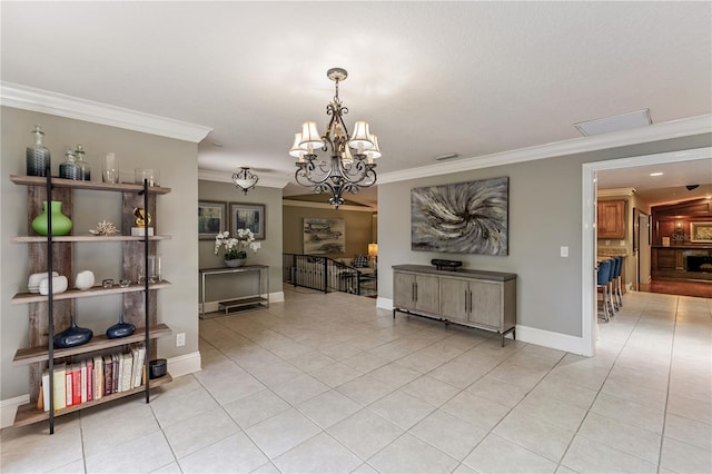 unfurnished dining area featuring light tile patterned flooring, an inviting chandelier, and ornamental molding