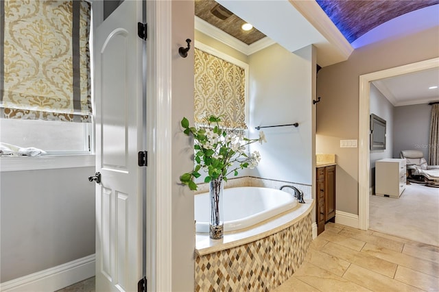 bathroom with a relaxing tiled tub, vanity, and ornamental molding