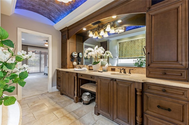 bathroom with vanity, vaulted ceiling, and brick ceiling