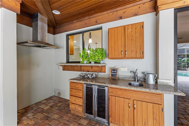 kitchen with wooden ceiling, sink, beverage cooler, and ventilation hood