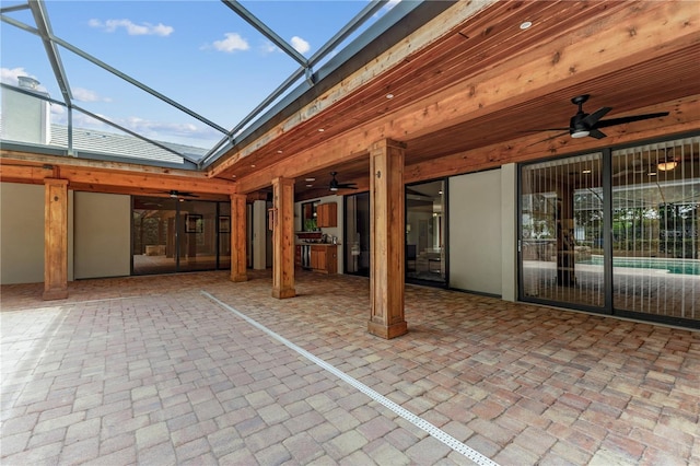 view of patio / terrace featuring a lanai and ceiling fan