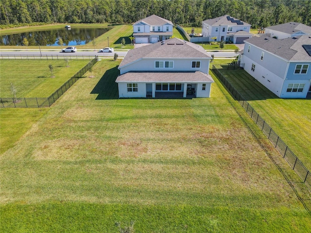 birds eye view of property with a water view