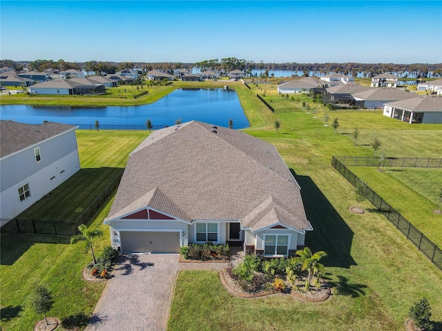 birds eye view of property with a water view