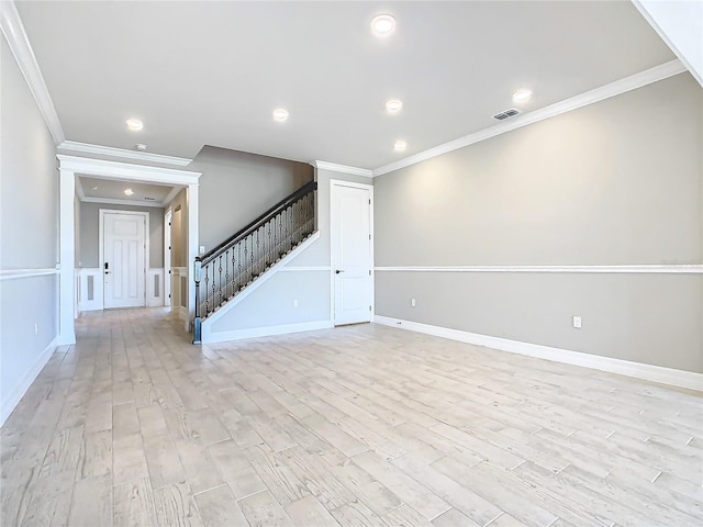 unfurnished room featuring crown molding and light hardwood / wood-style floors