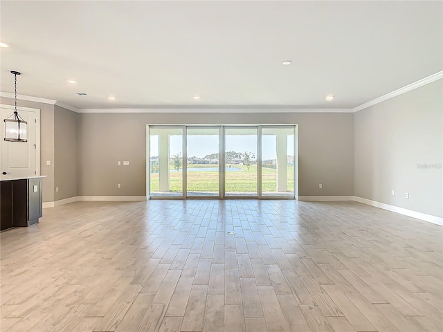 unfurnished living room featuring ornamental molding and light wood-type flooring